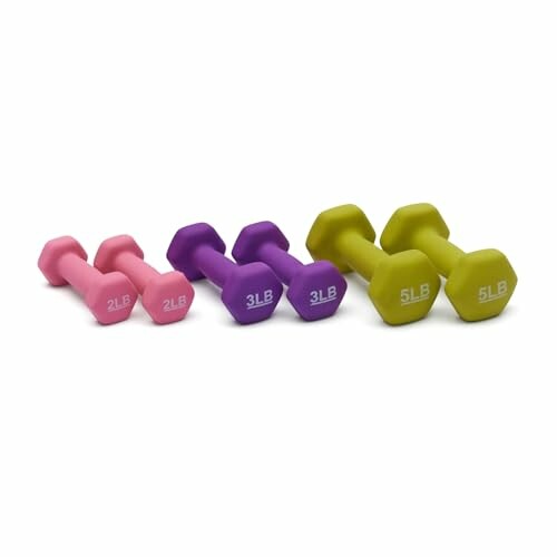 Set of pink, purple, and green dumbbells in different weights.