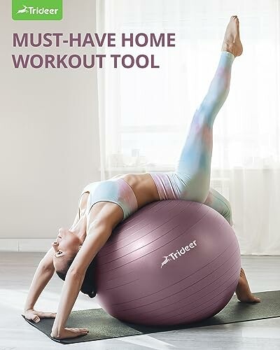 Woman performing yoga pose on exercise ball